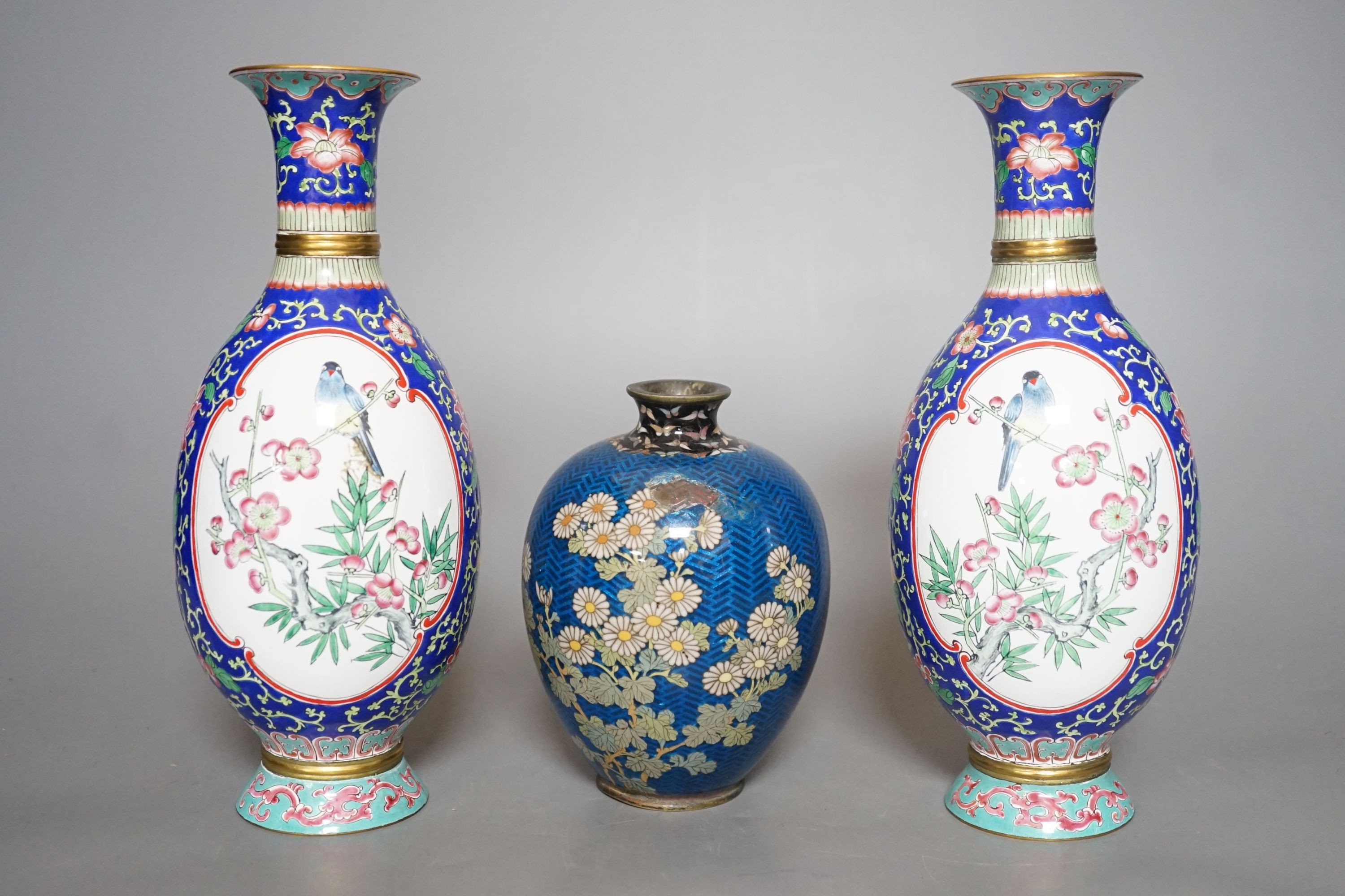 A Japanese floral cloisonné enamel vase, 13cm tall, together with two Canton enamel vases